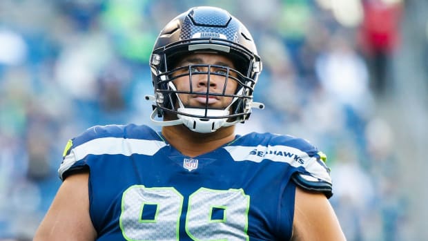 Seattle Seahawks defensive tackle Al Woods (99) returns to the locker room following the first half against the Jacksonville Jaguars at Lumen Field.